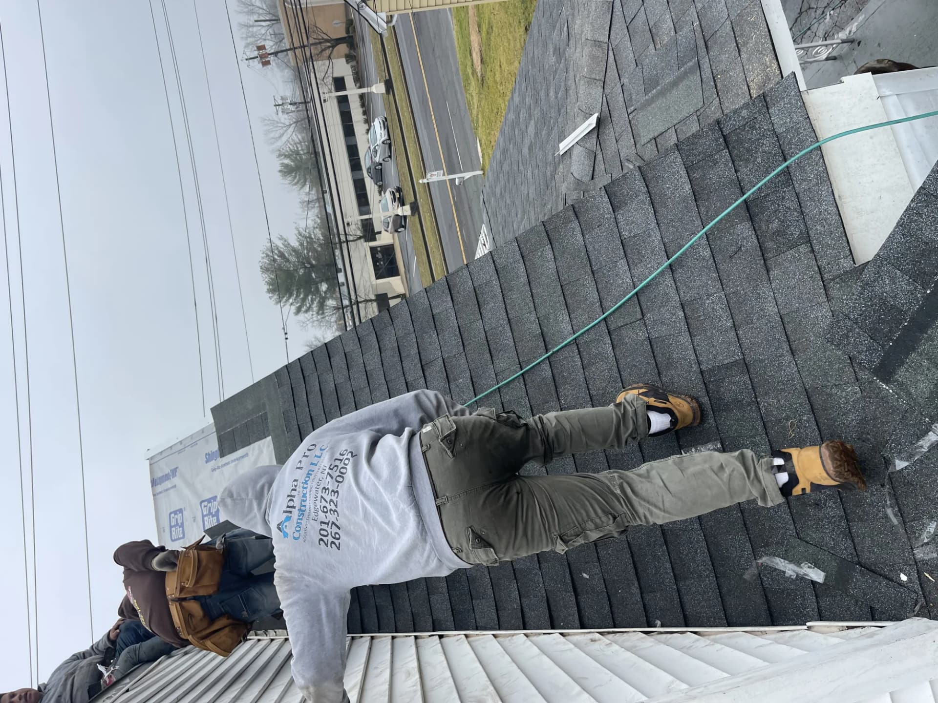 Alpha Pro Construction roofer installing a roof on a New Jersey home