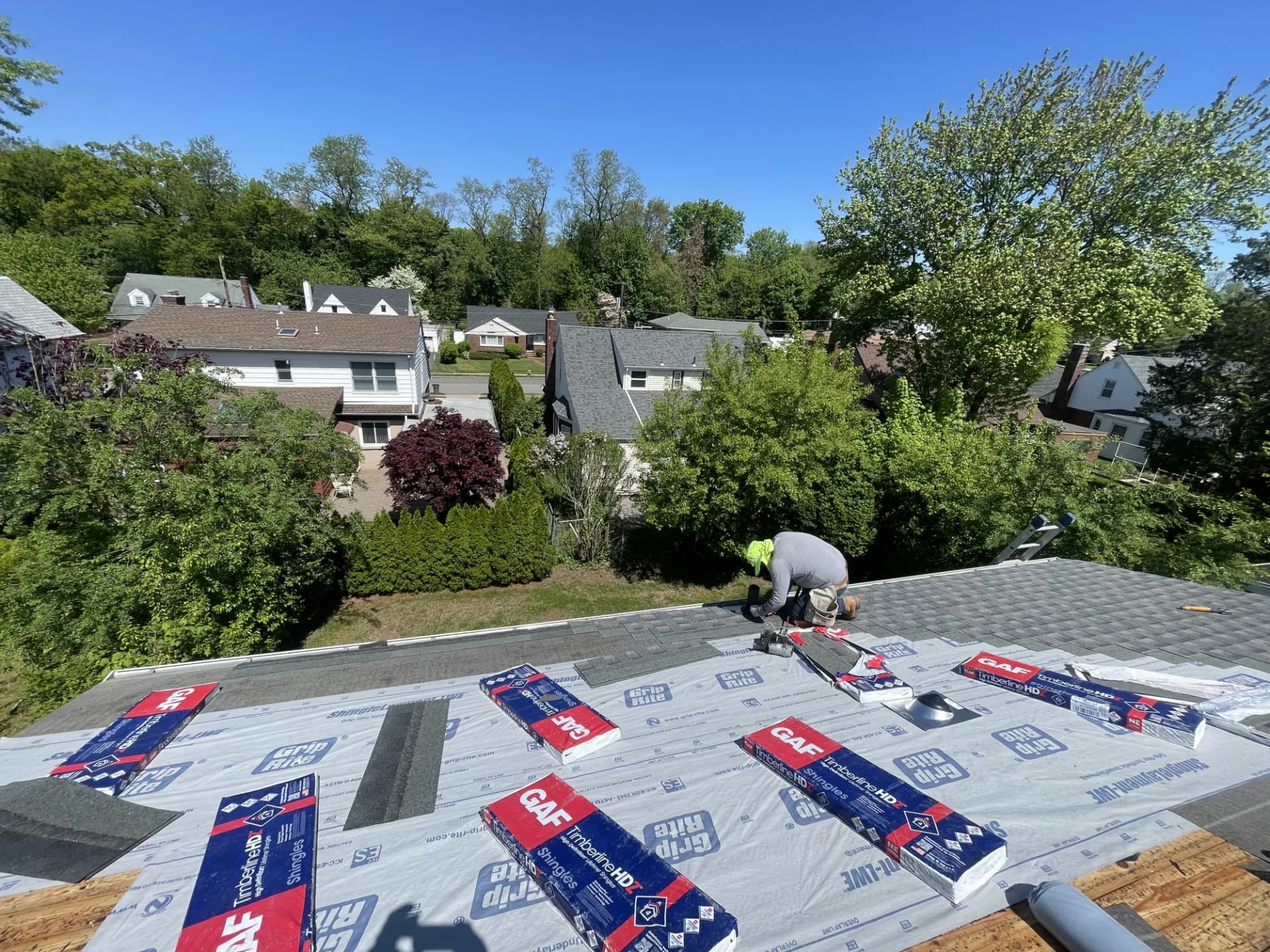 GAF Timberline HD shingle bundles laid out on residential roof deck during replacement in New Jersey