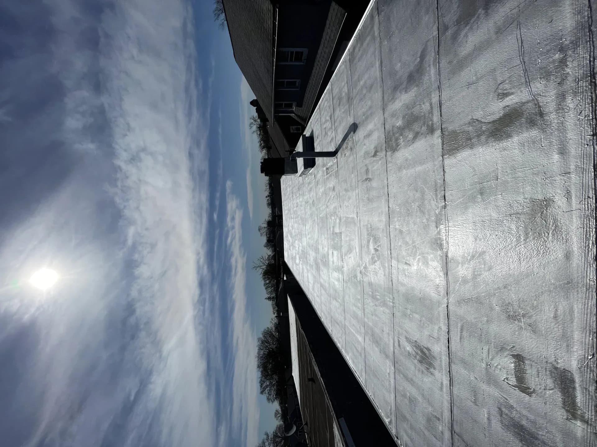 Newly installed reflective standing seam metal roof on a residential home in New Jersey
